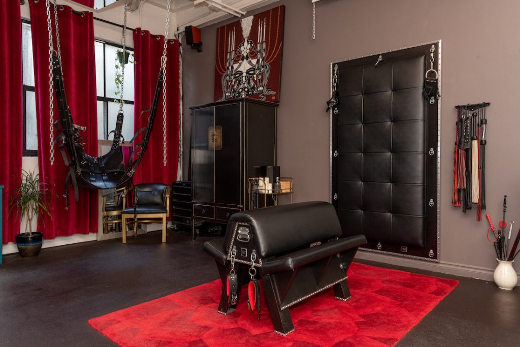 A private dungeon rental includes our cushy spanking bench, leather sling, and padded wall.