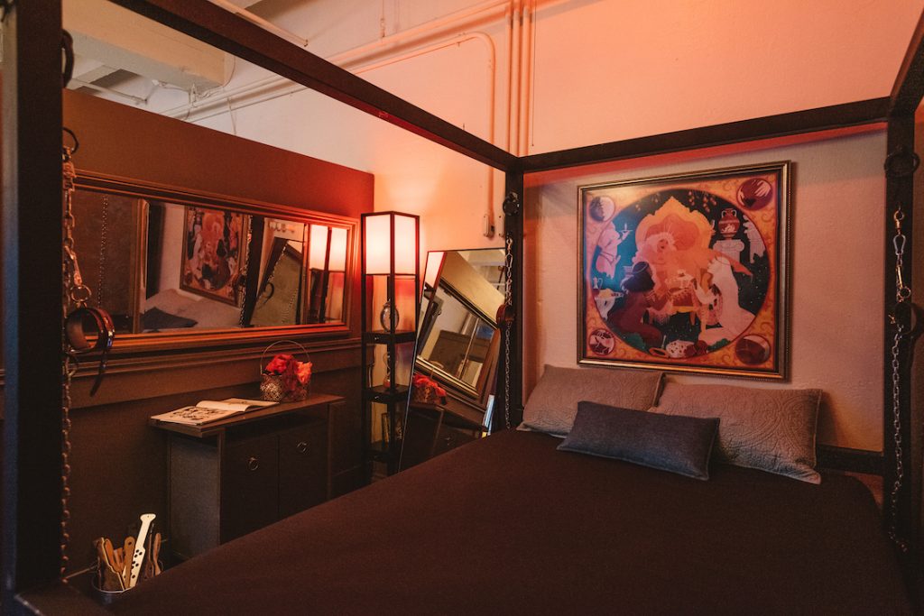 A private dungeon rental includes our iron bondage queen-sized bed, with plenty of hard points. Comfy for overnights.