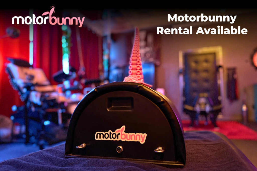 The Motorbunny is a powerful saddle-style vibrator, shown with a tentacle attachment in Sub Rosa's playspace